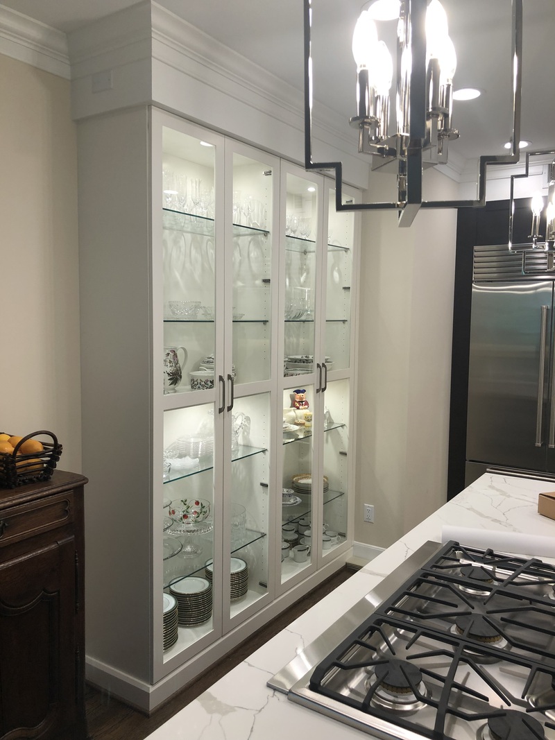 AFTER HARVEY MAPLE CABNETS ALL DEMO'D AND REPLACED WITH CUSTOM GLASS DISPLAY CABINETS.